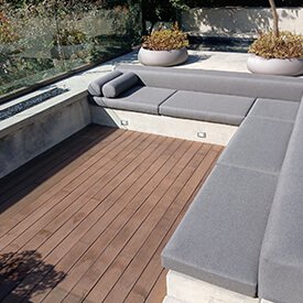 Custom-made seat cushions for outdoor dining chairs on a luxury residential patio in Van Nuys.