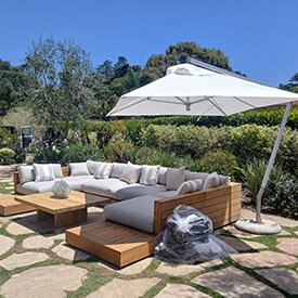 Luxury outdoor daybed and pool lounge chairs with custom white upholstery in Van Nuys, California.