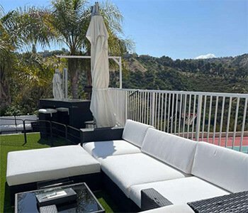 Custom luxury white cushions for an outdoor sectional sofa on a residential patio in Van Nuys, California.