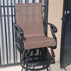 Custom modern seat cushions for outdoor dining chairs on a contemporary patio in Van Nuys.